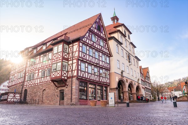 Sunset over a characteristic half-timbered building on a quiet town square, town hall, spring, Calw, Black Forest, Germany, Europe