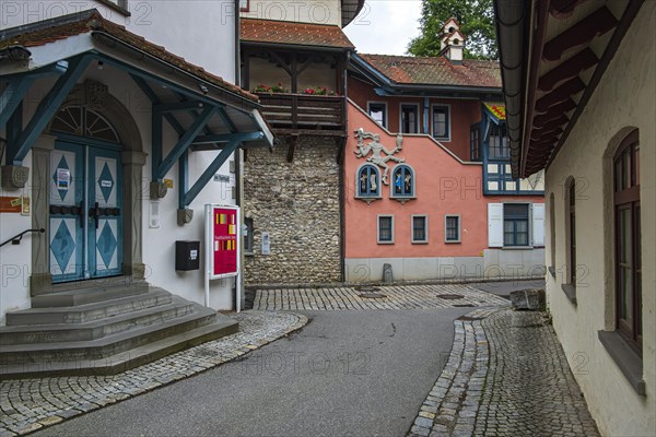 Historic factory building, at the time of the photo the seat of the Isny public library, and parts of the medieval town wall in the old town of Isny im Allgaeu, Baden-Wuerttemberg, Germany, as at 9 June 2020, Europe