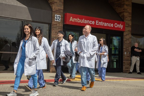 Detroit, Michigan USA, 18 April 2024, Doctors walk out of the emergency room at Ascension St. John Hospital to begin a one-day strike to protest understaffing and unsafe conditions. The emergency room is operated by Team Health, which is owned by the private equity firm Blackstone. The 43 emergency doctors, physician assistants, and nurse practitioners organized the Greater Deroit Association of Emergency Physicians nearly a year ago