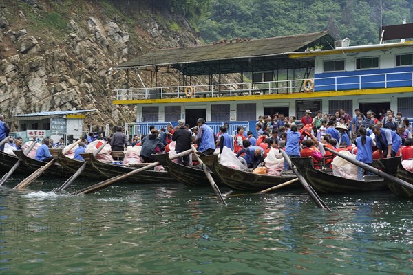 Passengers boarding boats at a pier for a tour on the river, Yichang, Yichang, Hubei Province, China, Asia