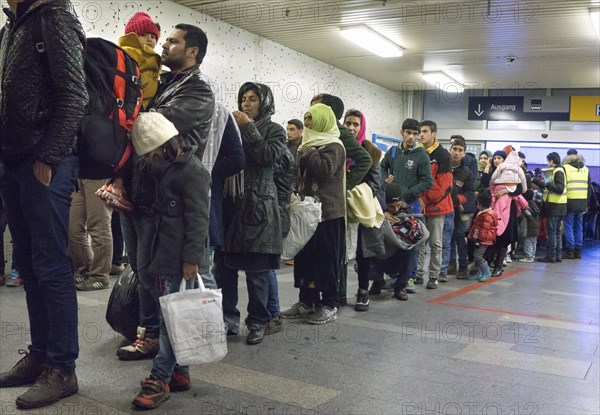 Refugees have arrived at Schoenefeld station on an IC train. They are then taken by bus to accommodation in Berlin, 02.12.2015, Schoenefeld, Brandenburg, Germany, Europe