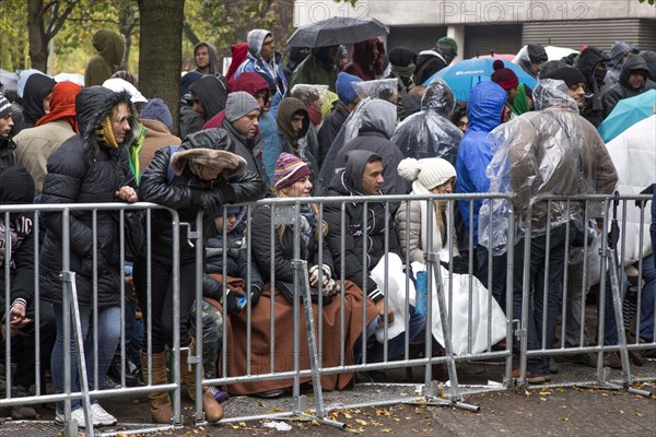 Syrian refugees wait for their registration in cold and wet weather at the Berlin State Office for Health and Social Affairs, 15 October 2015, Berlin, Berlin, Germany, Europe