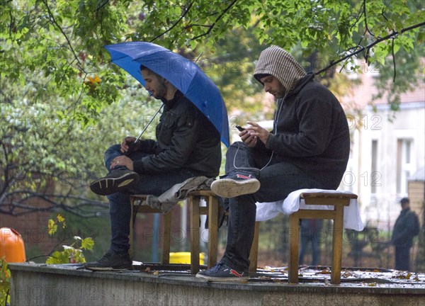 Syrian refugees wait for their registration in cold and wet weather at the Berlin State Office for Health and Social Affairs, 20 October 2015, Berlin, Berlin, Germany, Europe