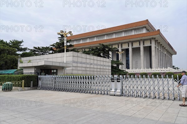 Beijing, China, Asia, Modern building with wide steps and pedestrians in front of it in cloudy weather, Asia