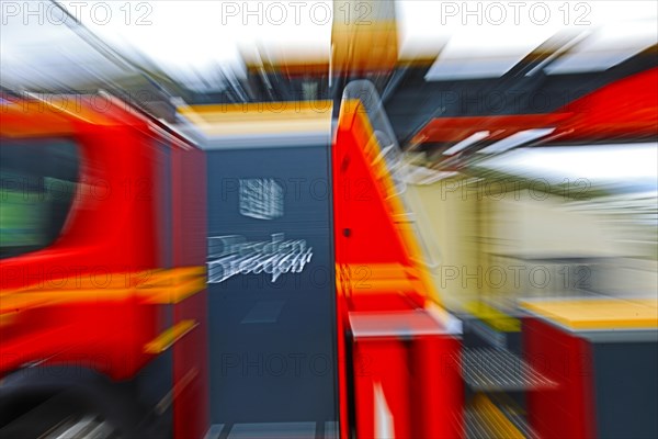 Close-up of a moving fire engine with coat of arms