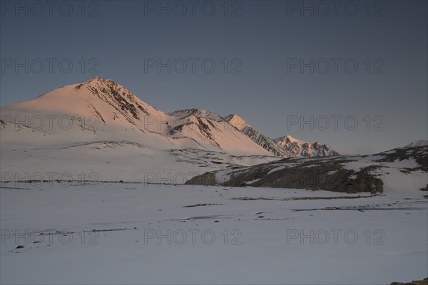 Sunrise at the snowy Cold Peak, 3373m, Tavan Bogd National Park, Mongolian Altai Mountains, Western Mongolia, Mongoleii