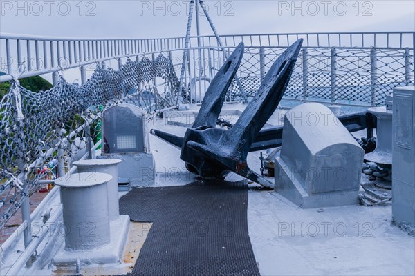 Large black anchor on deck of battleship on display at Unification Park in Gangneung, South Korea, Asia