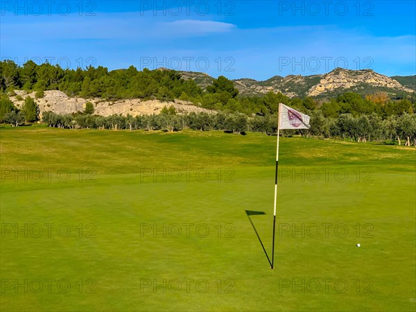 Golf du Domaine de Mainville with Golf Flag and Ball on Putting Green in France