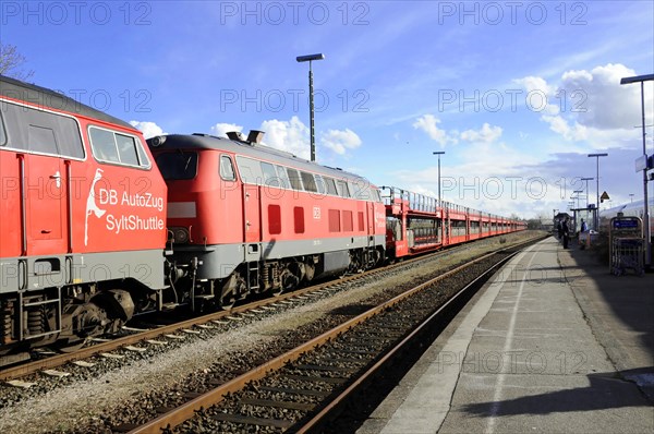 Red DB AutoZug Sylt Shuttle standing on tracks in sunny weather, Sylt, North Frisian Island, Schleswig-Holstein, Germany, Europe