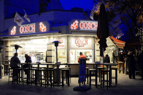 Evening, Westerland, Sylt, Schleswig-Holstein, Sylt, North Frisian Island, Schleswig Holstein, A busy restaurant with illuminated advertising at dusk, Sylt, North Frisian Island, Schleswig Holstein, Germany, Europe