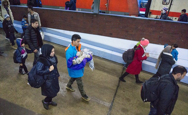 Refugees have arrived at Schoenefeld station on an IC train. They are then taken by bus to accommodation in Berlin, 02.12.2015, Schoenefeld, Brandenburg, Germany, Europe