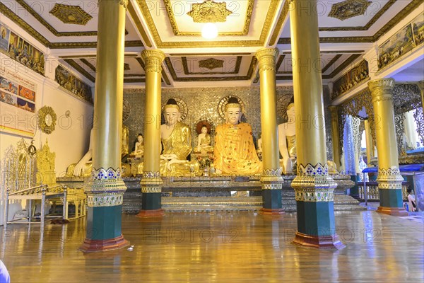 Shwedagon Pagoda, Yangon, Myanmar, Asia, Golden Buddha statues in a richly decorated interior of a temple in Myanmar, Asia