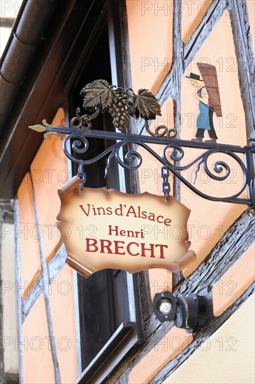 Eguisheim, Alsace, France, Europe, A decorative sign of a winery 'Vins d'Alsace Henri Brecht' on a house wall, Europe