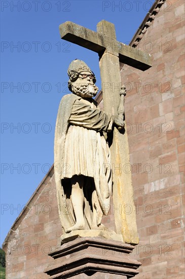 Kaysersberg, Alsace Wine Route, Alsace, Departement Haut-Rhin, France, Europe, Stone statue of a religious figure holding a cross against the sky, Europe