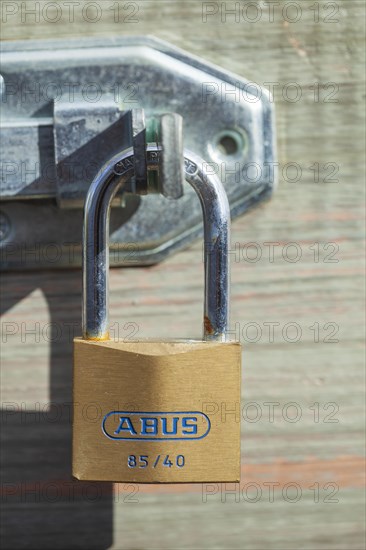 Padlock on a door bolt, Germany, Europe