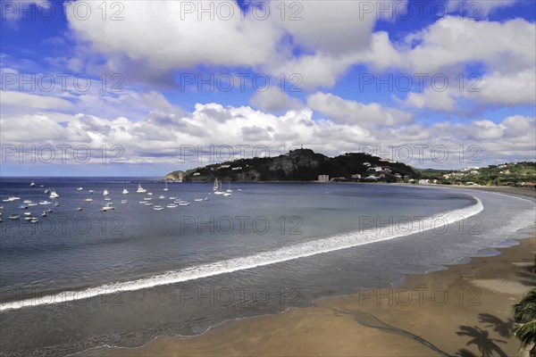San Juan del Sur, Nicaragua, A peaceful bay with a beach and yachts nestled in a green coastline, Central America, Central America