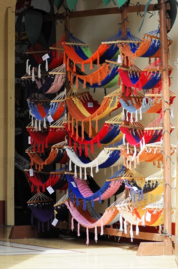 Granada, Nicaragua, Colourful hammocks displayed in front of a shop, hung on a large wooden frame, Central America, Central America -, Central America