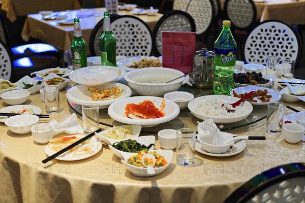 Dinner in a posh restaurant in Shanghai, China, Asia, A meal is over, leftovers and used crockery on a messy table, Shanghai, Asia