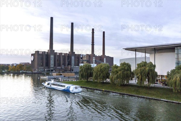 A ship passes the VW plant in Wolfsburg on the Mittelland Canal, 25 October 2015, Wolfsburg, Lower Saxony, Germany, Europe