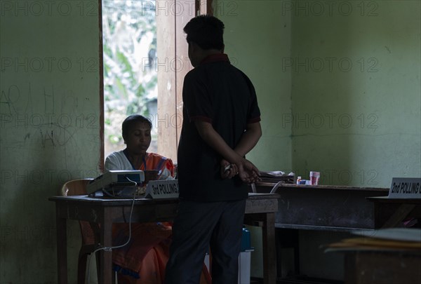 BOKAKHAT, INDIA, APRIL 19: Voters at a polling station to cast their votes during the first phase of the India's general elections on April 19, 2024 in Bokakhat, Assam, India. Nearly a billion Indians vote to elect a new government in six-week-long parliamentary polls starting today