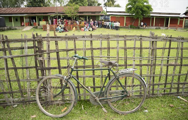 BOKAKHAT, INDIA, APRIL 19: Voters wait in line at a polling station to cast their votes during the first phase of the India's general elections on April 19, 2024 in Bokakhat, Assam, India. Nearly a billion Indians vote to elect a new government in six-week-long parliamentary polls starting today