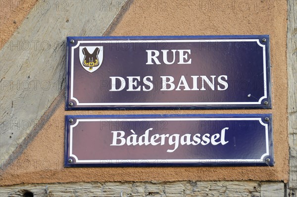 Kaysersberg, Alsace Wine Route, Alsace, Departement Haut-Rhin, France, Europe, A bilingual alleyway sign shows 'Rue des Bains' and 'Baedergassel', Europe