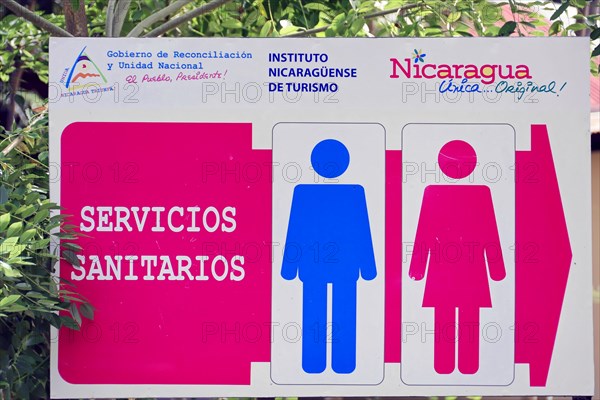 Granada, Nicaragua, A colourful sign marks toilets with blue and pink gender symbols, Central America, Central America