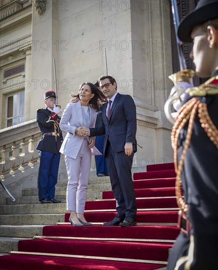 Annalena Baerbock (Alliance 90/The Greens), Federal Foreign Minister, takes a photo as part of her participation in the international humanitarian conference on Sudan and its neighbouring countries. Here she is greeted by Stephane Sejourne, Foreign Minister of France, at the Quai d'Orsay Foreign Ministry. 'Photographed on behalf of the Federal Foreign Office'