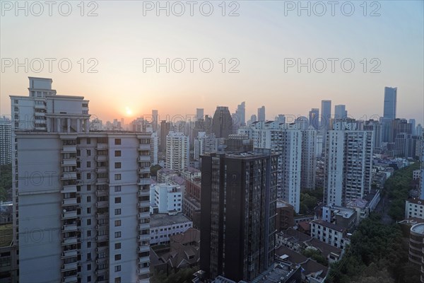 Shanghai, China, Asia, City skyline at sunset with highlighted illumination of buildings, People's Republic of China, Asia