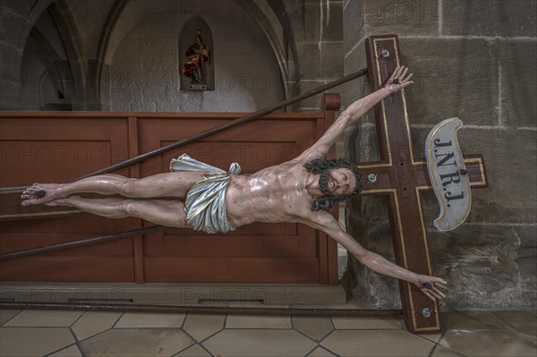 Life-size, carved figure of Jesus on the cross, 350-year-old processional figure in St Michael's Church, Neunkirchen am Brand, Middle Franconia, Bavaria, Germany, Europe