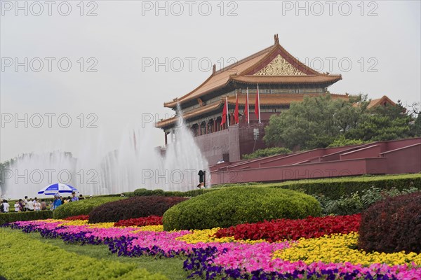 China, Beijing, Forbidden City, UNESCO World Heritage Site, A historic building seen from a distance, surrounded by colourful flowers and water fountains, Asia