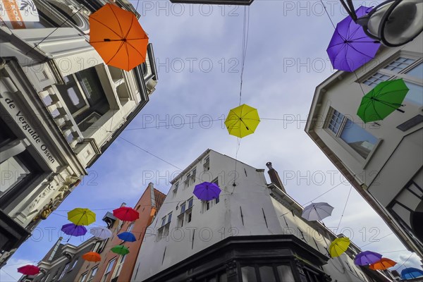 Colourful colourful umbrellas in the city centre, centre, jewellery, decorated, decoration, festive, umbrella, colourful, joyful, atmosphere, urban, design, hanging, hanging, travel, city trip, tourism, shopping, shopping, home, architecture, Dutch, creative, Deventer, Netherlands