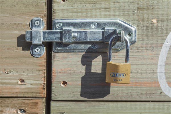 Padlock on a door bolt, Germany, Europe