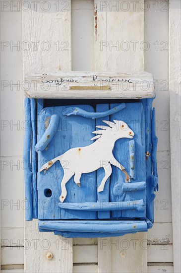 Letterbox with horse motif, Saintes-Maries-de-la-Mer, Camargue, Bouches-du-Rhone, Provence-Alpes-Cote d'Azur, South of France, France, Europe
