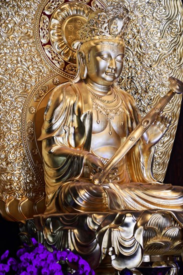 Jade Buddha temple, Shanghai, Detailed golden Buddha statue with fine handwork and ornate embossing, Shanghai, China, Asia