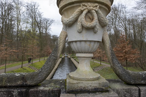 View from a stone bridge with an ornamental vase onto a canal in the castle park, Ludwigslust, Mecklenburg-Vorpommern, Germany, Europe