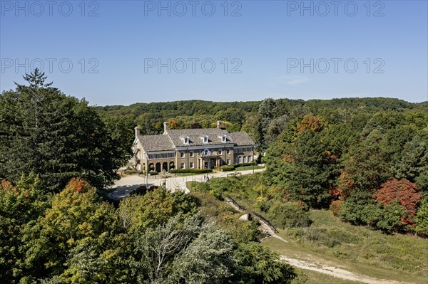 Saugatuck, Michigan, The Felt Mansion. Built as a summer home for Dorr and Agnes Felt in the 1920s, the 12, 000 square foot house has 25 rooms and a ballroom on three floors. The restored building is now used for special events. Felt became a millionnaire after inventing the Comptometer, which performed basic math functions