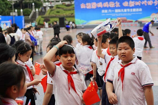 School class in the centre of Chongqing near the museum, the teacher has given his permission for the photo, Chongqing, China, Asia, pupils with red scarves and casual clothes are talking outside, Chongqing province, Asia