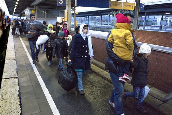 Refugees have arrived at Schoenefeld station on an IC train. They are then taken by bus to accommodation in Berlin, 02.12.2015, Schoenefeld, Brandenburg, Germany, Europe