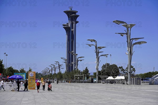 Beijing, China, Asia, people walking along a wide path with a gigantic tower in the background, Asia