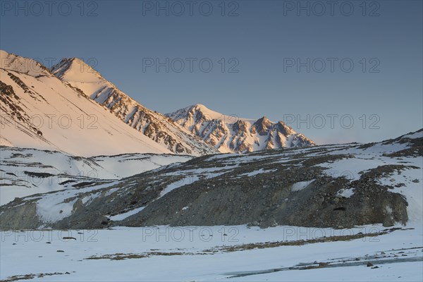 Sunrise at the snowy Cold Peak, Mongolian Chueiten, 3373m, Tavan Bogd National Park, Mongolian Altai Mountains, Western Mongolia, Mongolia, Asia