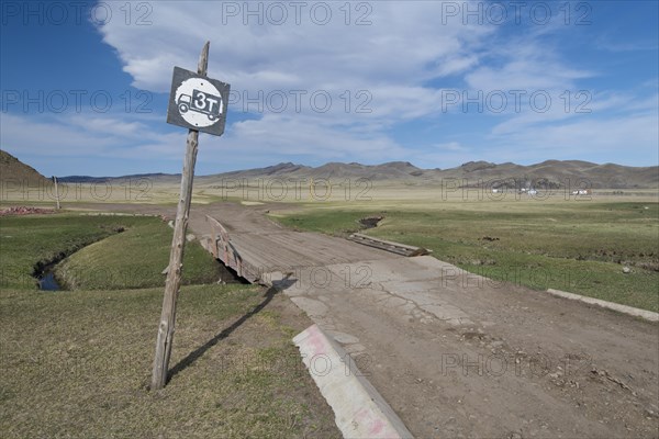 Simple bridge over a watercourse in the grassland on the way to Amarbayasgalant Monastery, Selenge Aimak, Selenge Province, Mongolia, Asia