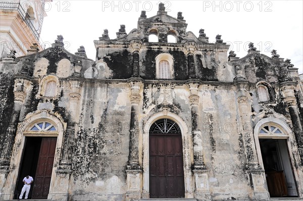 Church Iglesia de Guadalupe, built 1624 -1626, Granada, Nicaragua, Weathered church facade with three doors and one person, Central America, Central America -, Central America