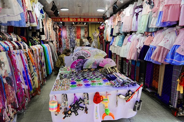 Stroll through Shanghai to the sights, Shanghai, China, Asia, A small lively market stall with a selection of clothes and accessories, Asia