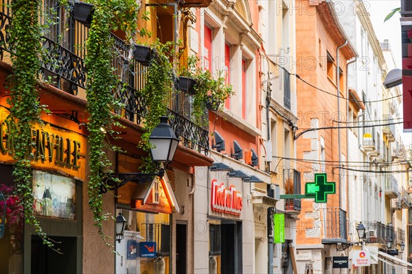 Narrow streets with shops in the city centre of Figueras, Spain, Europe