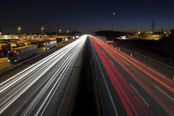 Light trails on the A2 motorway, night shot, long exposure, Bottrop, Ruhr area, North Rhine-Westphalia, Germany, Europe