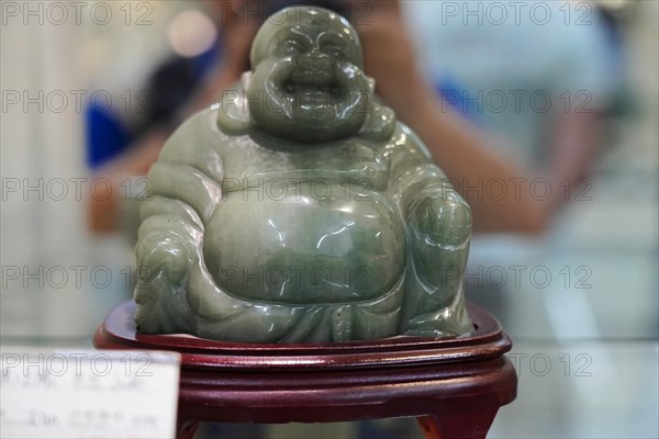 Xian, Shaanxi Province, China, Asia, A jade Buddha sculpture is presented in a display case, Xian, Shaanxi Province, China, Asia