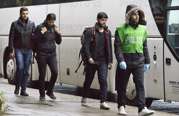 Refugees have arrived at Schoenefeld station on an IC train. They are then taken by bus to accommodation in Berlin, 02.12.2015, Schoenefeld, Brandenburg, Germany, Europe