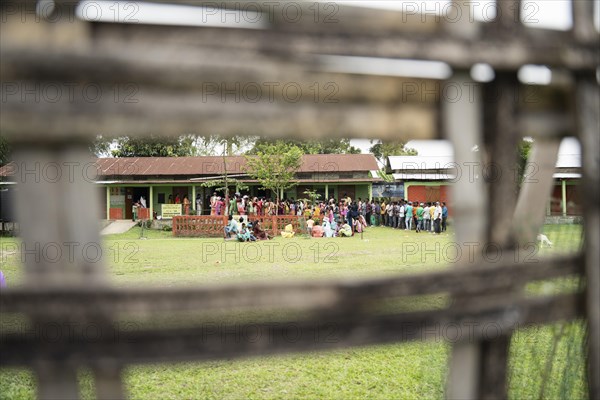 BOKAKHAT, INDIA, APRIL 19: Voters wait in line at a polling station to cast their votes during the first phase of the India's general elections on April 19, 2024 in Bokakhat, Assam, India. Nearly a billion Indians vote to elect a new government in six-week-long parliamentary polls starting today