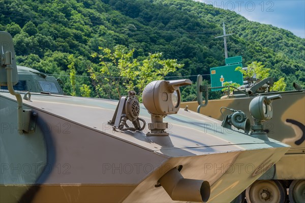Closeup front view of headlights on military vehicle on display in public park in Nonsan, South Korea, Asia